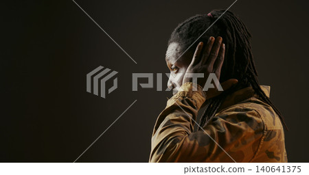 Young adult showing three wise monkeys symbol over black background, advertising the principle to see no evil, hear no evil, speak no evil, male model covering his mouth, eyes and ears. Young adult showing three wise monkeys symbol over black background, advertising the principle to see no evil, hear no evil, speak no evil, male model covering his mouth, eyes and ears. 140641375