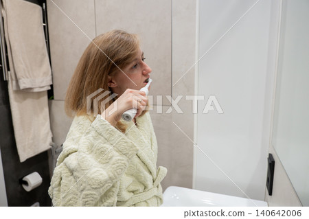 Woman prepares swiftly each morning, Woman quickly gets ready to ensure her day begins seamlessly, An organized lady immediately prepares herself to start her day efficiently and without pause Woman prepares swiftly each morning, Woman quickly gets ready to ensure her day begins seamlessly, An organized lady immediately prepares herself to start her day efficiently and without pause 140642006