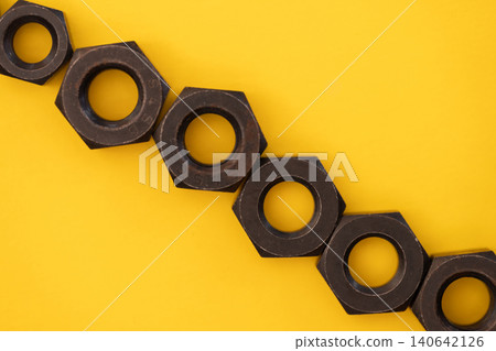 Nuts on yellow background 140642126