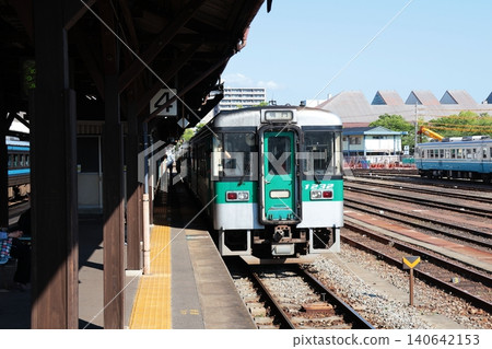 A Naruto Line train stopped at the platform of JR Tokushima Station. A Naruto Line train stopped at the platform of JR Tokushima Station. 140642153