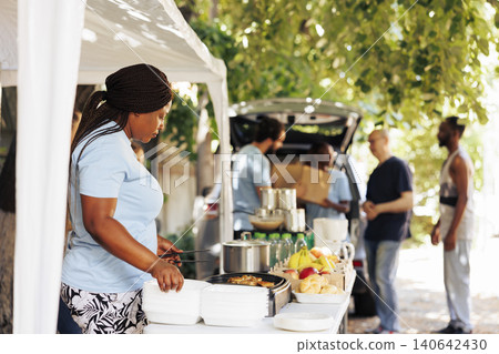 Charitable organization providing essential non-perishable items to refugees offering helping hand to the hungry and poor. Charitable organization providing essential non-perishable items to refugees offering helping hand to the hungry and poor. 140642430