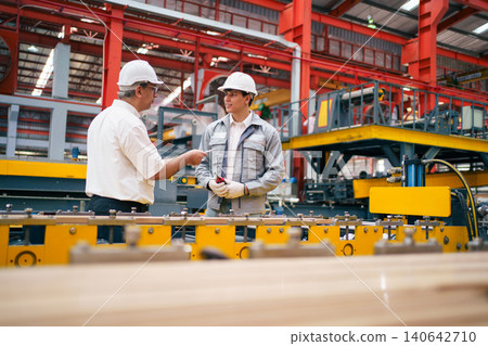 Senior manager and engineer discussing work in factory Senior manager and engineer discussing work in factory 140642710
