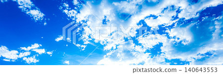 A simple yet dramatic landscape of blue sky and white clouds. A simple yet dramatic landscape of blue sky and white clouds. 140643553