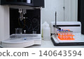 Automated Laboratory Analyzer with Sample Tubes and Glassware in Modern Clinical Lab 140643594