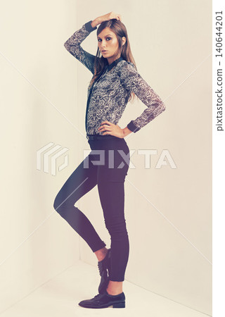 Vintage, fashion and portrait of woman for clothes, beauty and trendy with retro outfit isolated in studio background. Female person, model and lady with print shirt, formal trousers and shoes Vintage, fashion and portrait of woman for clothes, beauty and trendy with retro outfit isolated in studio background. Female person, model and lady with print shirt, formal trousers and shoes 140644201