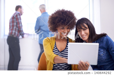 Women, casual and happy with tablet to search internet for online website or browsing social media, diversity and innovation. Female colleagues, technology and together for digital planning or design 140644292