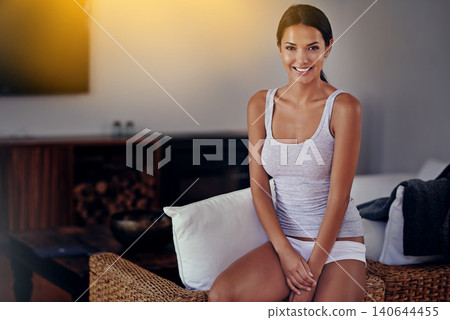 Woman, smile and portrait with underwear, living room and rest with couch to relax. Model, lounge and break with happiness, morning and routine with natural confidence sitting at home or house Woman, smile and portrait with underwear, living room and rest with couch to relax. Model, lounge and break with happiness, morning and routine with natural confidence sitting at home or house 140644455