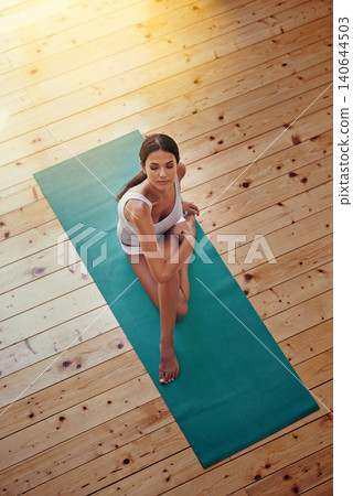 Yoga, wellness and woman in gym for exercise with zen, balance or health workout. Mindfulness, calm and high angle of female person with pilates training for fitness with mat on floor in studio. Yoga, wellness and woman in gym for exercise with zen, balance or health workout. Mindfulness, calm and high angle of female person with pilates training for fitness with mat on floor in studio. 140644503