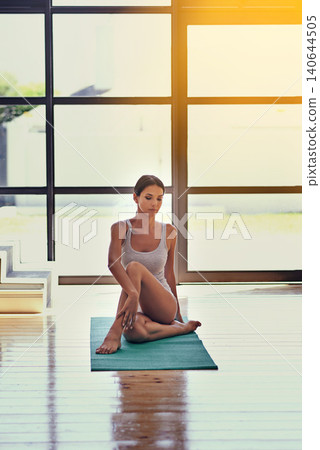 Yoga, health and woman stretching in gym for exercise with zen, wellness or balance workout. Mindfulness, peace and calm female person with pilates training for fitness with mat on floor in studio. Yoga, health and woman stretching in gym for exercise with zen, wellness or balance workout. Mindfulness, peace and calm female person with pilates training for fitness with mat on floor in studio. 140644505