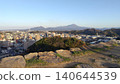 A panoramic view of Mt. Daisen, the highest peak in the Chugoku region, and the city of Yonago, as seen from the castle tower base of Yonago Castle ruins. 140644539