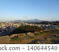 A panoramic view of Mt. Daisen, the highest peak in the Chugoku region, and the city of Yonago, as seen from the castle tower base of Yonago Castle ruins. 140644540