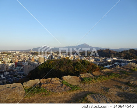 A panoramic view of Mt. Daisen, the highest peak in the Chugoku region, and the city of Yonago, as seen from the castle tower base of Yonago Castle ruins. A panoramic view of Mt. Daisen, the highest peak in the Chugoku region, and the city of Yonago, as seen from the castle tower base of Yonago Castle ruins. 140644540