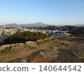 A panoramic view of Mt. Daisen, the highest peak in the Chugoku region, and the city of Yonago, as seen from the castle tower base of Yonago Castle ruins. 140644542