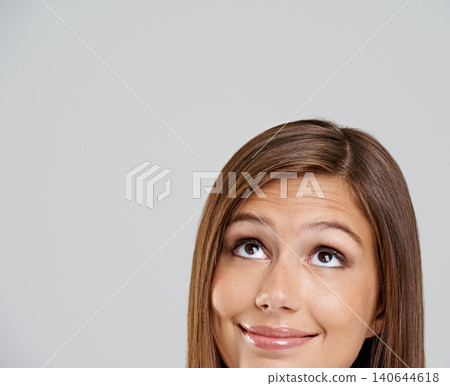 Studio, head and closeup with smile, thinking and mockup for idea or vision. Woman, planning and happy with optimism, positive and hopeful for future contemplating isolated on white background Studio, head and closeup with smile, thinking and mockup for idea or vision. Woman, planning and happy with optimism, positive and hopeful for future contemplating isolated on white background 140644618