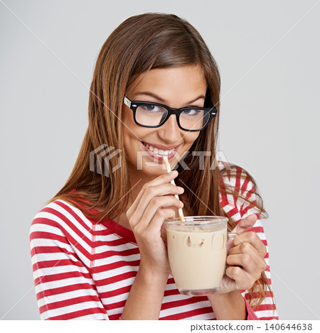 Woman, portrait and milkshake drinking in studio or sweet beverage for weekend relax, dessert or grey background. Female person, glasses and straw for chocolate smoothie, mockup space or happiness Woman, portrait and milkshake drinking in studio or sweet beverage for weekend relax, dessert or grey background. Female person, glasses and straw for chocolate smoothie, mockup space or happiness 140644638