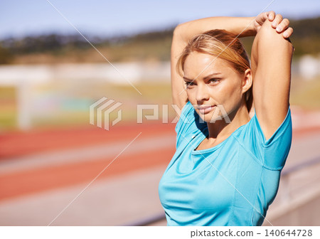 Fitness, arms and woman stretching in stadium for race, marathon or competition training for health. Sports, wellness and runner athlete with warm up exercise for running cardio workout on track. Fitness, arms and woman stretching in stadium for race, marathon or competition training for health. Sports, wellness and runner athlete with warm up exercise for running cardio workout on track. 140644728