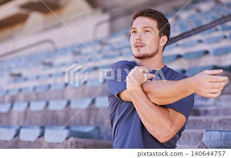 Sports, arms and man stretching in stadium for race, marathon or competition training for health. Fitness, energy and male runner athlete with warm up exercise for running cardio workout on track. Sports, arms and man stretching in stadium for race, marathon or competition training for health. Fitness, energy and male runner athlete with warm up exercise for running cardio workout on track. 140644757