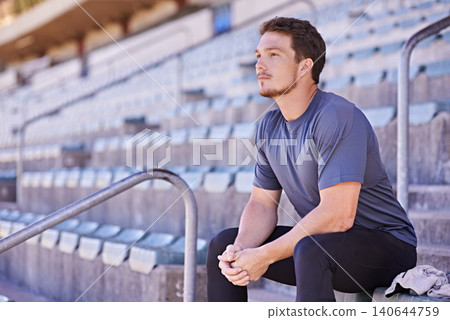 Man, thinking and idea in sport stadium with fitness, workout or exercise for planning. Male runner, wellness and training for performance, marathon race or commitment in track and field arena Man, thinking and idea in sport stadium with fitness, workout or exercise for planning. Male runner, wellness and training for performance, marathon race or commitment in track and field arena 140644759