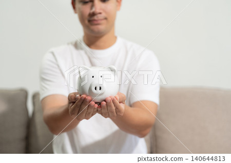 Man thinking of the concept of saving money. Man thinking of the concept of saving money. 140644813