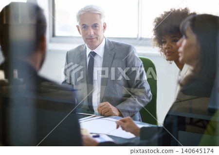 Business people, collaboration and meeting with documents in office for corporate planning, networking and diversity. Professional, employees and teamwork in boardroom with lens flare and cooperation Business people, collaboration and meeting with documents in office for corporate planning, networking and diversity. Professional, employees and teamwork in boardroom with lens flare and cooperation 140645174