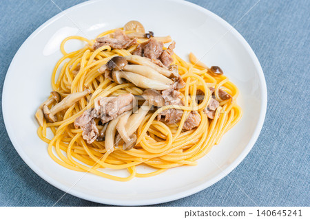 Japanese-style pasta with pork slices and mushrooms Japanese-style pasta with pork slices and mushrooms 140645241