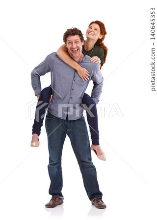 Piggy back, love and smile with couple, portrait and happiness isolated on a white studio background. People, man carrying woman and romance with marriage and bonding together with date and trust Piggy back, love and smile with couple, portrait and happiness isolated on a white studio background. People, man carrying woman and romance with marriage and bonding together with date and trust 140645353
