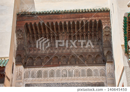 Arabic-Andalusian architecture showing intricate wood and stucco carvings in Fez, Morocco 140645450