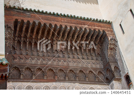Arabic-Andalusian architecture showing intricate wood and stucco carvings in Fez, Morocco 140645451