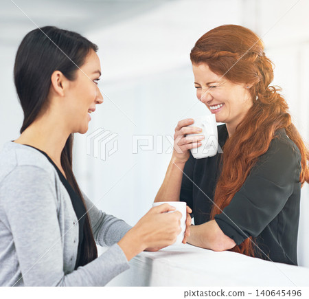 Business women, coffee and laughing with gossip, funny story or conversation with partner in office. Work friends, happy and listen with drink, latte and chat to start morning in corporate workplace Business women, coffee and laughing with gossip, funny story or conversation with partner in office. Work friends, happy and listen with drink, latte and chat to start morning in corporate workplace 140645496