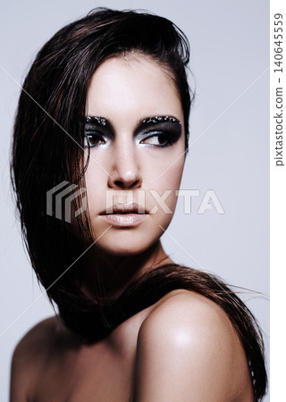 Woman, smokey and eyes with makeup in studio for art and beauty, thinking and wondering with thoughts for cosmetics. Female person, isolated and white background with eyeshadow or cosmetology. Woman, smokey and eyes with makeup in studio for art and beauty, thinking and wondering with thoughts for cosmetics. Female person, isolated and white background with eyeshadow or cosmetology. 140645559