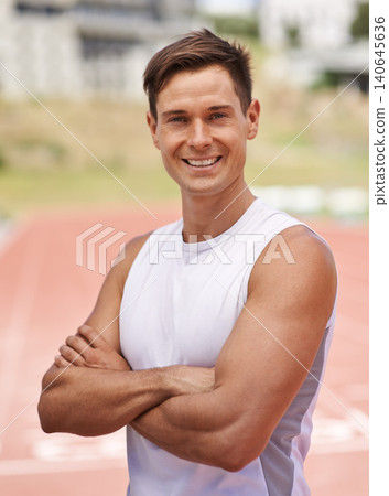 Athlete, portrait and happy for fitness on stadium, commitment and wellness of sprinting professional. American, man and face with smile for confident in sport, outdoor and training for health body Athlete, portrait and happy for fitness on stadium, commitment and wellness of sprinting professional. American, man and face with smile for confident in sport, outdoor and training for health body 140645636