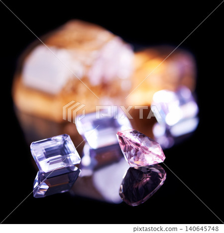 Gemstone, pink diamond and amethyst in studio with isolated black background for natural resource, jewel and sparkle for luxury. Rock, crystal and reflection in closeup for shine, glow and mineral Gemstone, pink diamond and amethyst in studio with isolated black background for natural resource, jewel and sparkle for luxury. Rock, crystal and reflection in closeup for shine, glow and mineral 140645748
