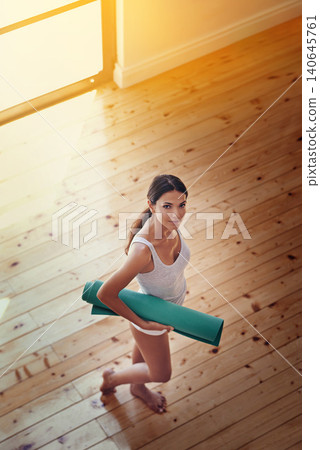 Woman, portrait and mat for yoga in home, wellness and above for spiritual awareness. Happy female person, pilates and exercise or fitness in living room, zen and mindfulness for morning routine Woman, portrait and mat for yoga in home, wellness and above for spiritual awareness. Happy female person, pilates and exercise or fitness in living room, zen and mindfulness for morning routine 140645761