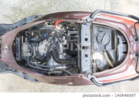 The entire interior of a 125cc scooter with the seat removed (after internal cleaning) 140646097