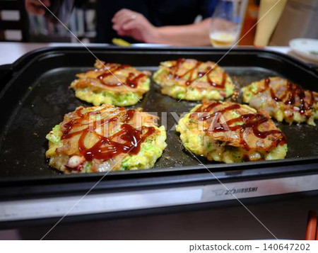 Okonomiyaki cooking kitchen 140647202