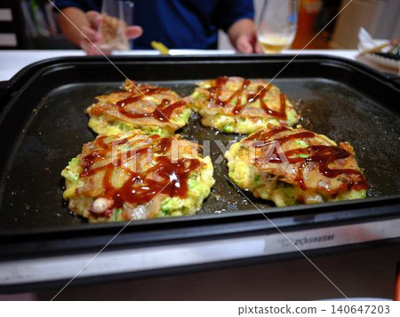 Okonomiyaki cooking kitchen 140647203