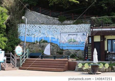 Coastal Mural and Outdoor Seating Area 140647251