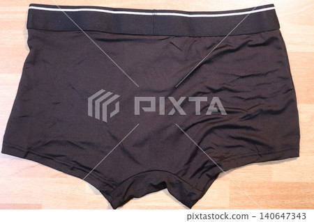 Black Men's Boxer Briefs on Wooden Floor 140647343