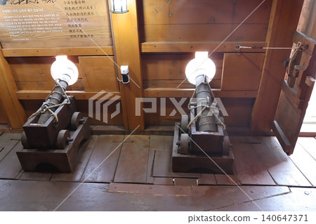 Historic Cannons in Wooden Museum Display 140647371