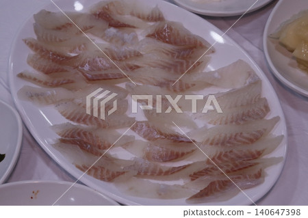 Fresh Raw Fish Slices on White Plate Fresh Raw Fish Slices on White Plate 140647398