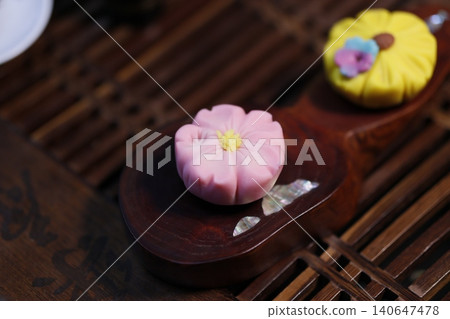 Delicate Flower-Shaped Pastries on Wooden Trays Delicate Flower-Shaped Pastries on Wooden Trays 140647478