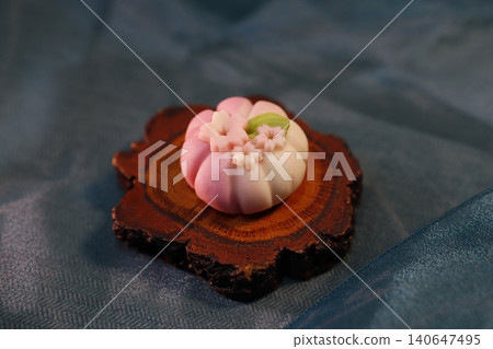 Delicate Pink and White Wagashi on Wooden Slice Delicate Pink and White Wagashi on Wooden Slice 140647495