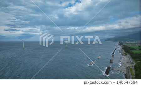 Scenes of offshore wind turbines along the Toyama Bay coast during strong winds as the rainy season begins. Scenes of offshore wind turbines along the Toyama Bay coast during strong winds as the rainy season begins. 140647584