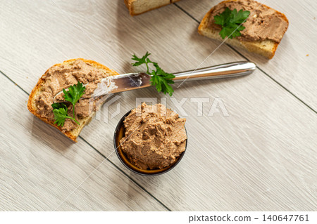 Homemade pate appetizer with bread and fresh herbs Homemade pate appetizer with bread and fresh herbs 140647761