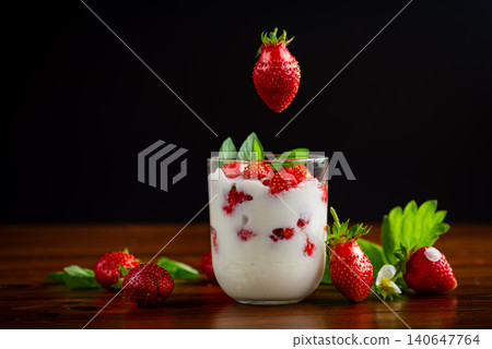 Delicious summer dessert with berries and green leaves Delicious summer dessert with berries and green leaves 140647764