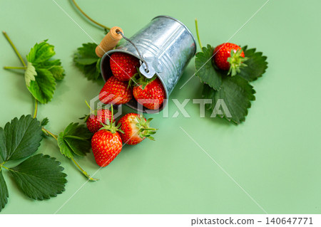 Top view of fresh strawberries with green leaves Top view of fresh strawberries with green leaves 140647771