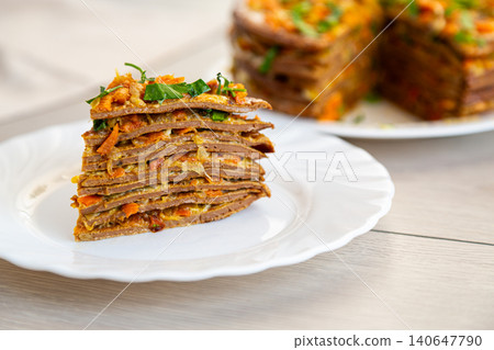 festive liver cake with carrot filling on plate closeup festive liver cake with carrot filling on plate closeup 140647790