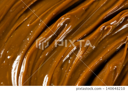 Swirling dulce de leche pattern close up for dessert. Swirling dulce de leche pattern close up for dessert. 140648210