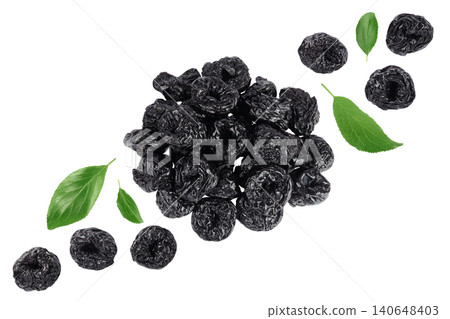 Prunes isolated on white background, heap of dried plums. Top view. Flat lay Prunes isolated on white background, heap of dried plums. Top view. Flat lay 140648403