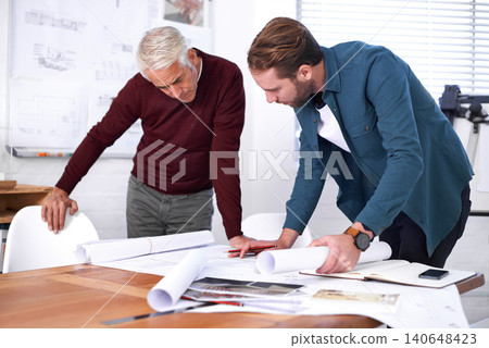 Coworker, man and blueprint with drawing at office with pencil for a building design or renovation, teamwork and project as architects. Business, people and collaboration on task, plan and layout Coworker, man and blueprint with drawing at office with pencil for a building design or renovation, teamwork and project as architects. Business, people and collaboration on task, plan and layout 140648423